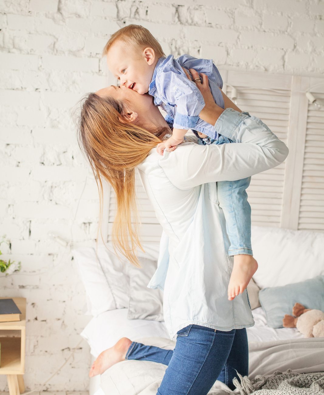 Happy Mother and Son Hugging. Mother and Child Having Fun at Home. Parental Love and Care Concept